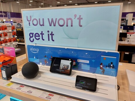 a display of alexa products, and at the top is a cut off promotional sign that says "You won't get it".