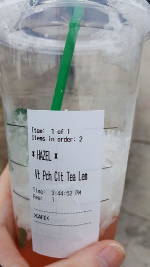 a peach citrus iced tea lemonade from Starbucks with the name Hazel on it