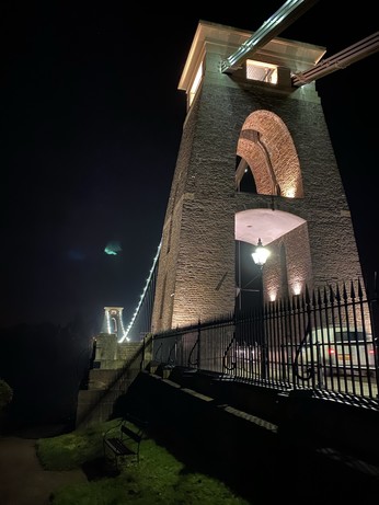 The east pillar of the Clifton Suspension Bridge. The areas around it are much more illuminated, revealing a bench that was not visible before. 
