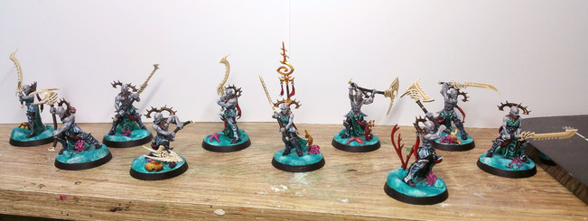 10 Namarti Thralls (sea elves with big swords/polearms) stood on various underwater scenery.