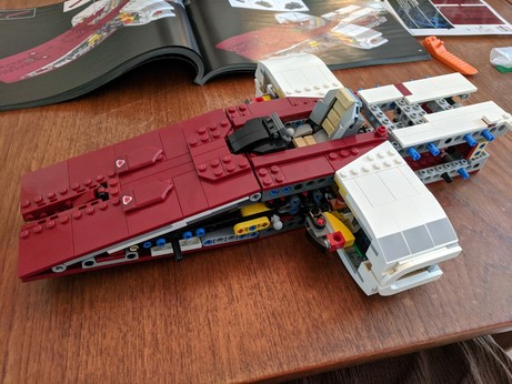 The model now has a curved extension to the chassis on each side where the laser cannon will emerge, and which will be joined to the front slope by pieces yet unassembled. This thing is like a foot fucking long at this point.