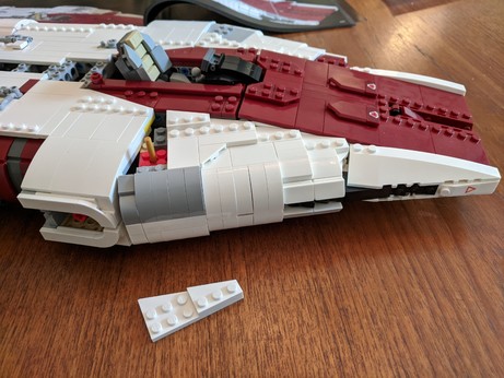 The wedge and chassis are joined, the locking pin is standing upright in the hole it will occupy.
