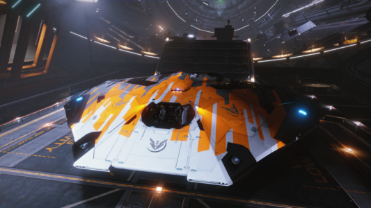 Elite: Dangerous screenshot showing a Cobra Mk III spacecraft in the hangar of a spaceport.