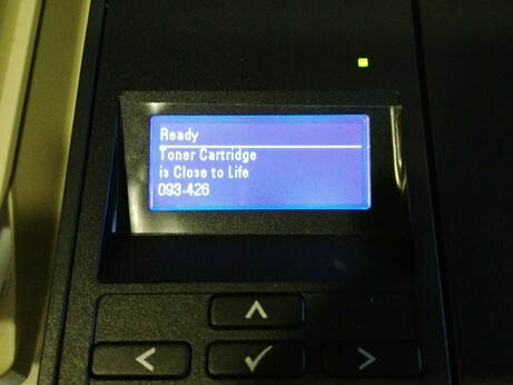 a printer displaying "Toner Cartridge is Close to Life"