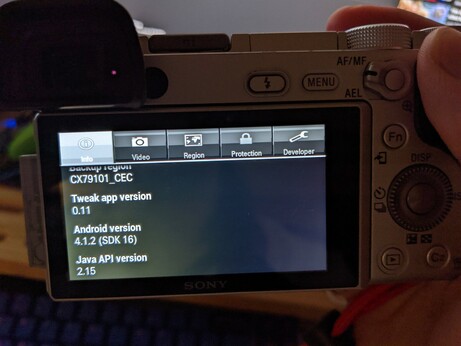 a Sony alpha 6300 displaying "Android version 4.1.2"