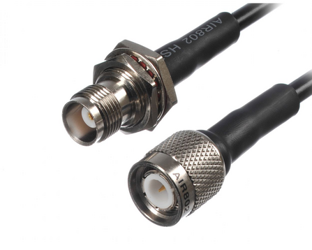 two TNC connectors, a plug and a receptacle. They have identical internal dimensions to BNC, but are screwed on instead of BNC's bayonet coupling. This gives better shield continuity and slightly better high-frequency performance, though not by too much. When high-frequency performance is needed, you'd generally go to SMA or N and skip TNC entirely, so these are kind of rare.

They feel like tiny N connectors when screwing them together.