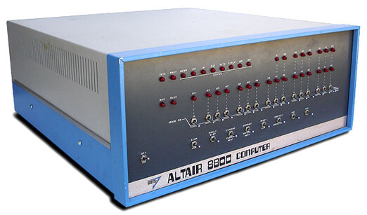 picture of the altair 8800 computer kit, with its front panel visible. notable on the front panel is the series of switches that users needed to flip in order to write programs to the computer without having access to e.g. a teletype terminal