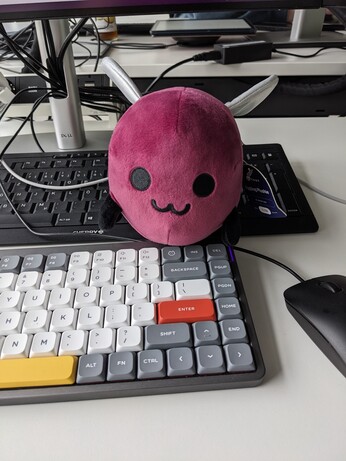 eggbug plush on a keyboard 