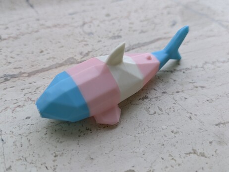 a trans-flag-striped low-poly blåhaj