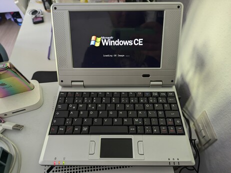 a terrible tiny netbook showing a Windows CE boot logo